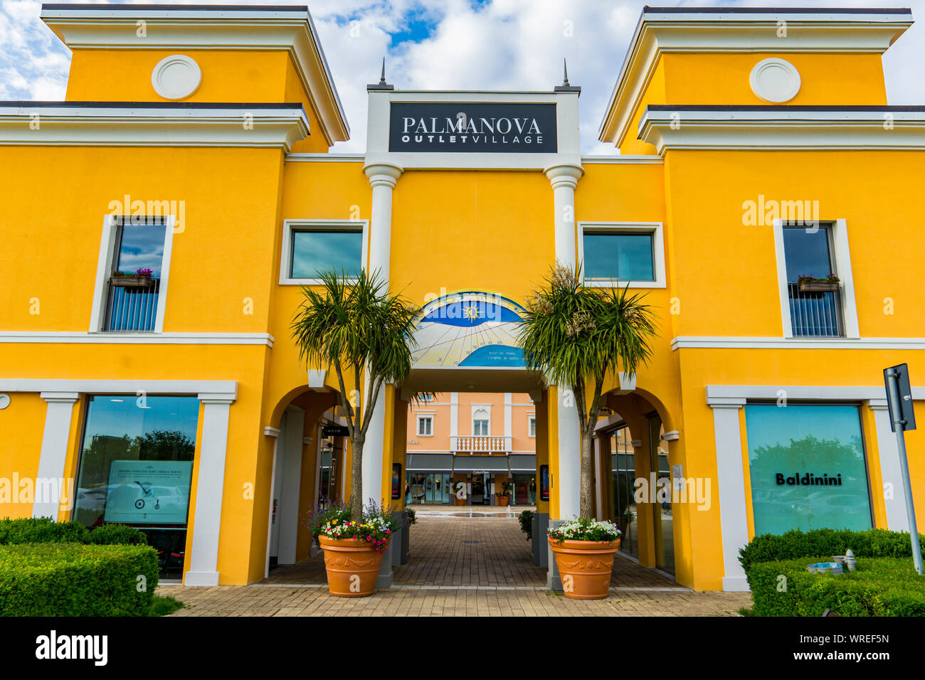 PALMANOVA, ITALY - MAY 23, 2019: Entrance at Palmanova Outlet Village in  Italy. Village was opened in 2008 and hosts over 90 retailers Stock Photo -  Alamy
