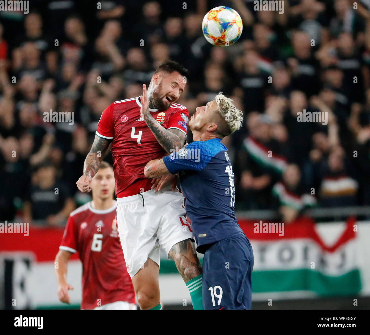 BUDAPEST, HUNGARY - SEPTEMBER 9: (l-r) Tamas Kadar of Hungary battles for the ball in the air with Juraj Kucka of Slovakia during the 2020 UEFA European Championships group E qualifying match between Hungary and Slovakia at Groupama Arena on September 9, 2019 in Budapest, Hungary. Stock Photo
