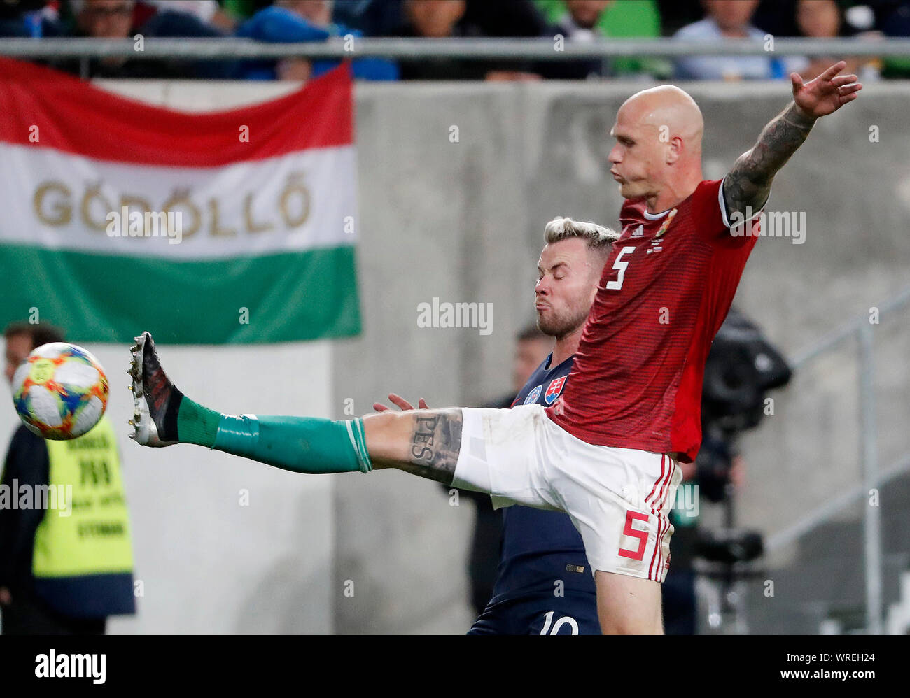 BUDAPEST, HUNGARY - SEPTEMBER 9: (r-l) Botond Barath of Hungary fights for the ball with Albert Rusnak of Slovakia during the 2020 UEFA European Championships group E qualifying match between Hungary and Slovakia at Groupama Arena on September 9, 2019 in Budapest, Hungary. Stock Photo