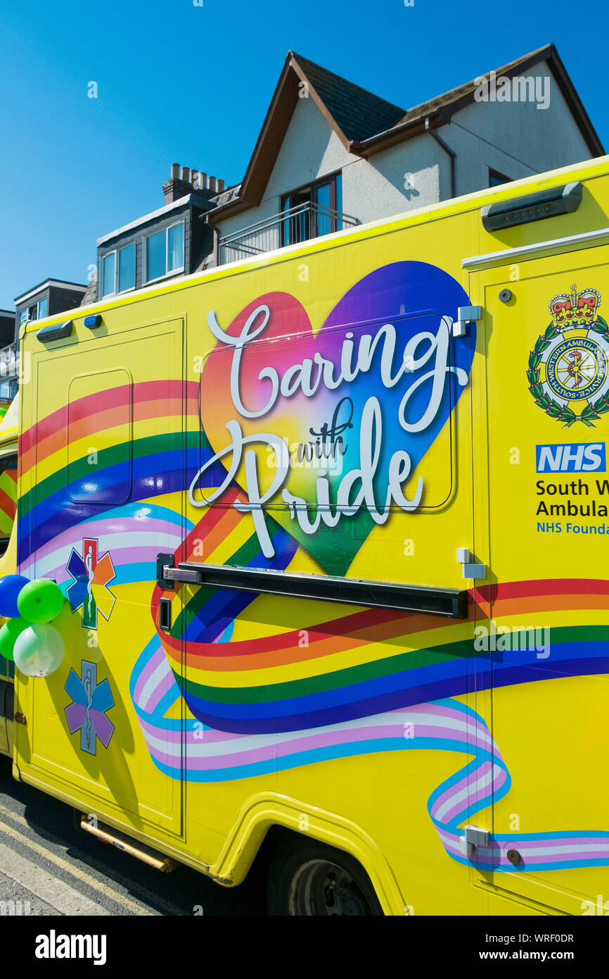 A NHS ambulance decorated with Gay Pride rainbow colours in the Cornwall Gay Pride Parade in Newquay in Cornwall. Stock Photo