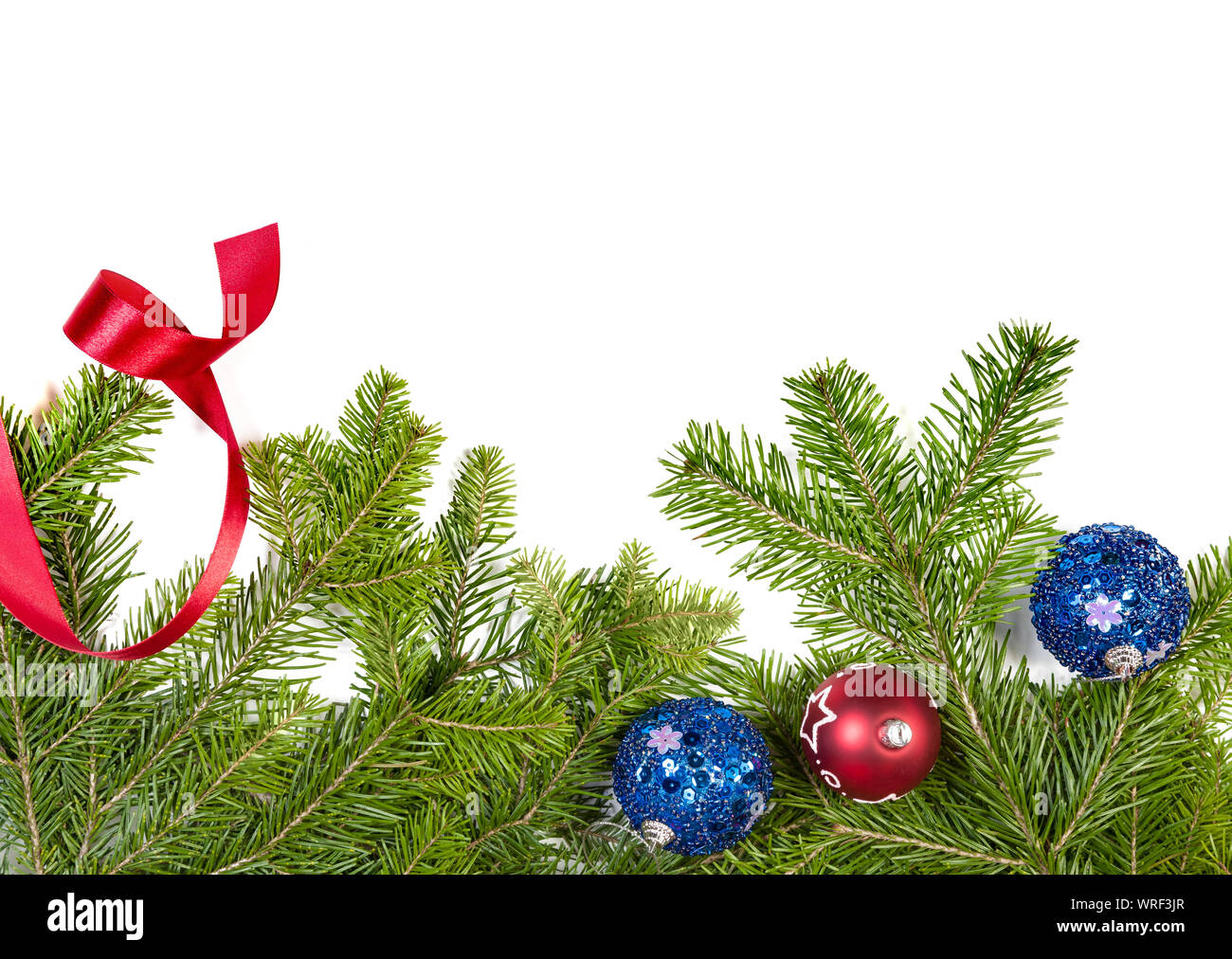Christmas background. Christmas fir tree with decoration on white background. Top view, copy space Stock Photo