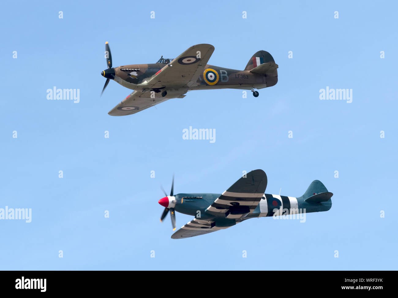 A Hurricane and Spitfire flying as part of the Battle of Britain Memorial Flight at the 2019 Southport Air Show Stock Photo