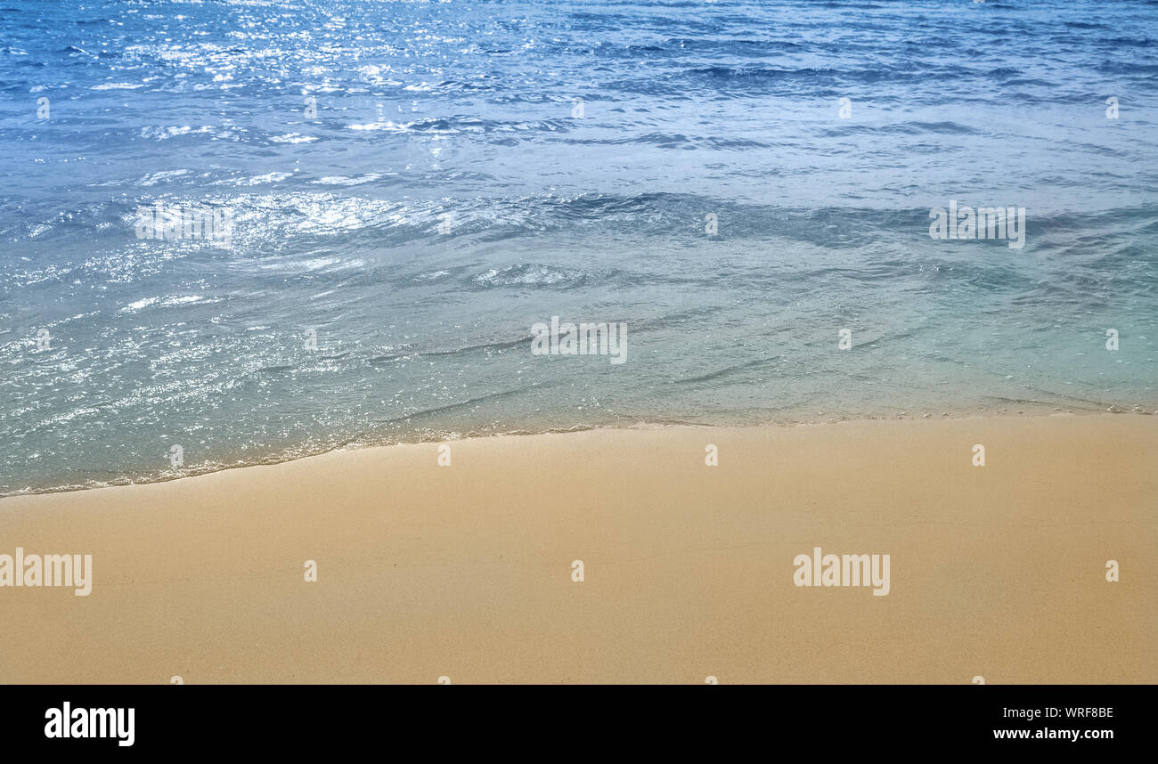 Soft ocean wave on clean sandy tropical beach Stock Photo