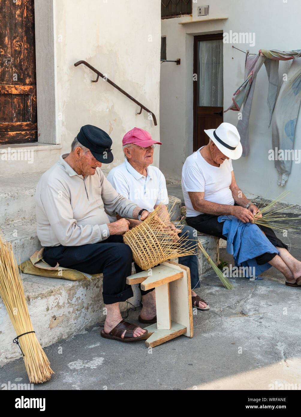Fishing traps, known as 'Nasse', and baskets being made in the Street in Gallipoli old town, Puglia, Italy. Stock Photo