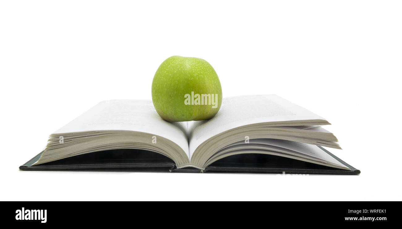 Open book with apple on it isolated on white background Stock Photo - Alamy