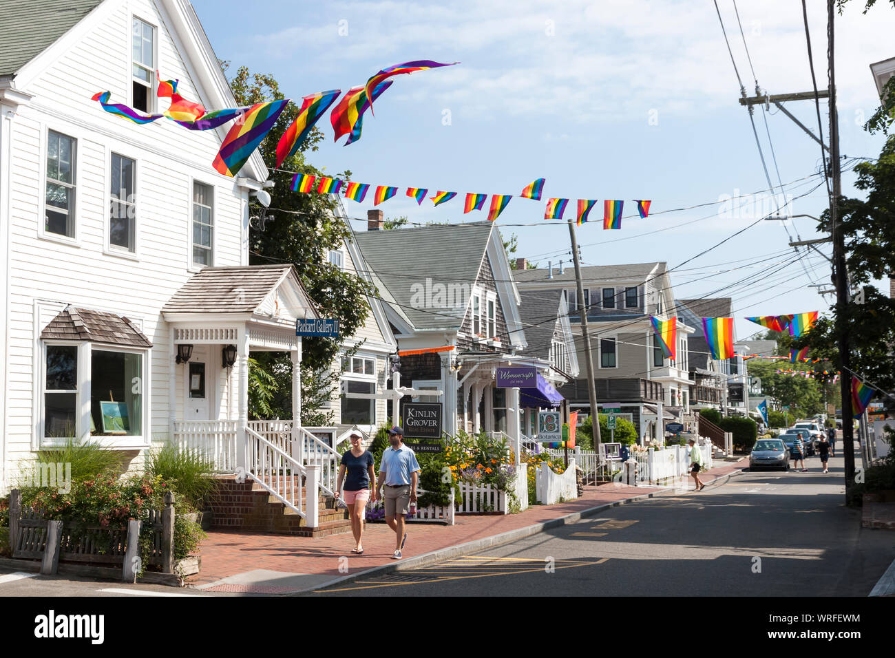 A couple walking along Commercial Street in Provincetown, Massachusetts. Stock Photo