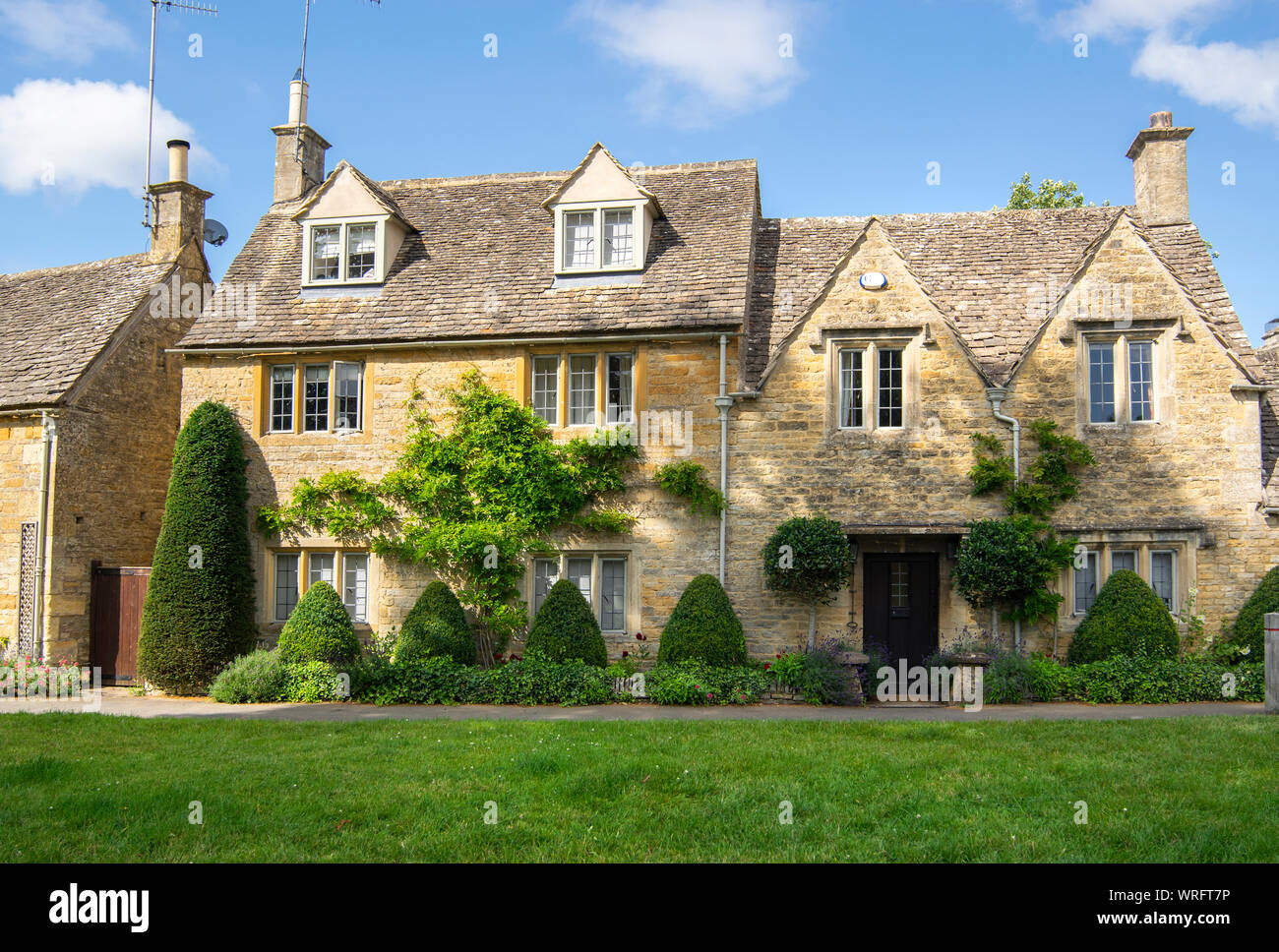Row of houses in Lower Slaughter in the Cotswolds, England, UK Stock