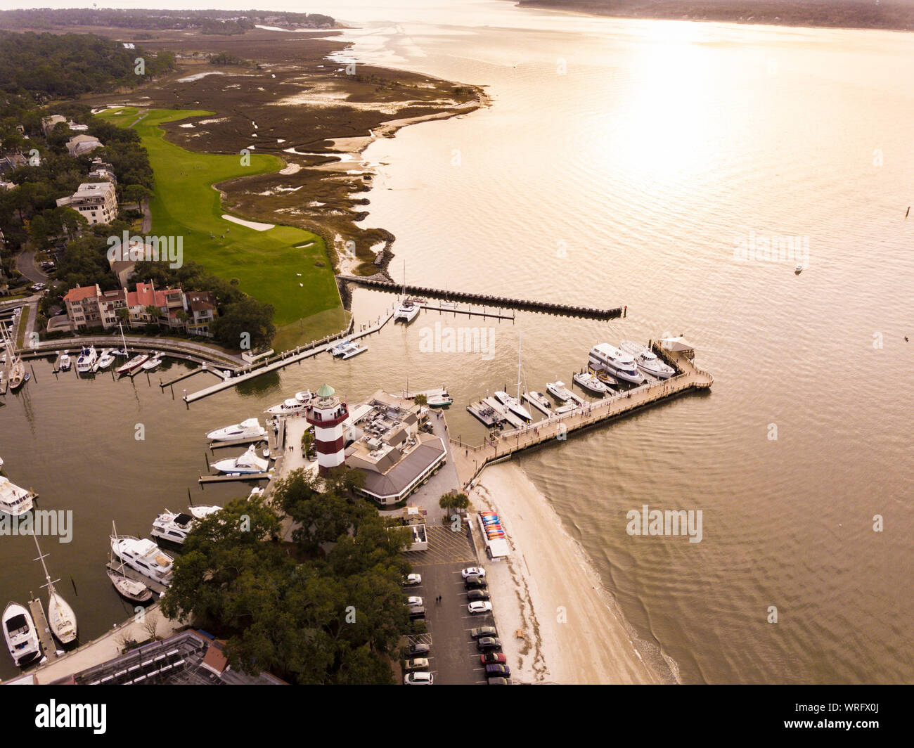 Aerial view of Hilton Head with lighthouse, beach, and golf course