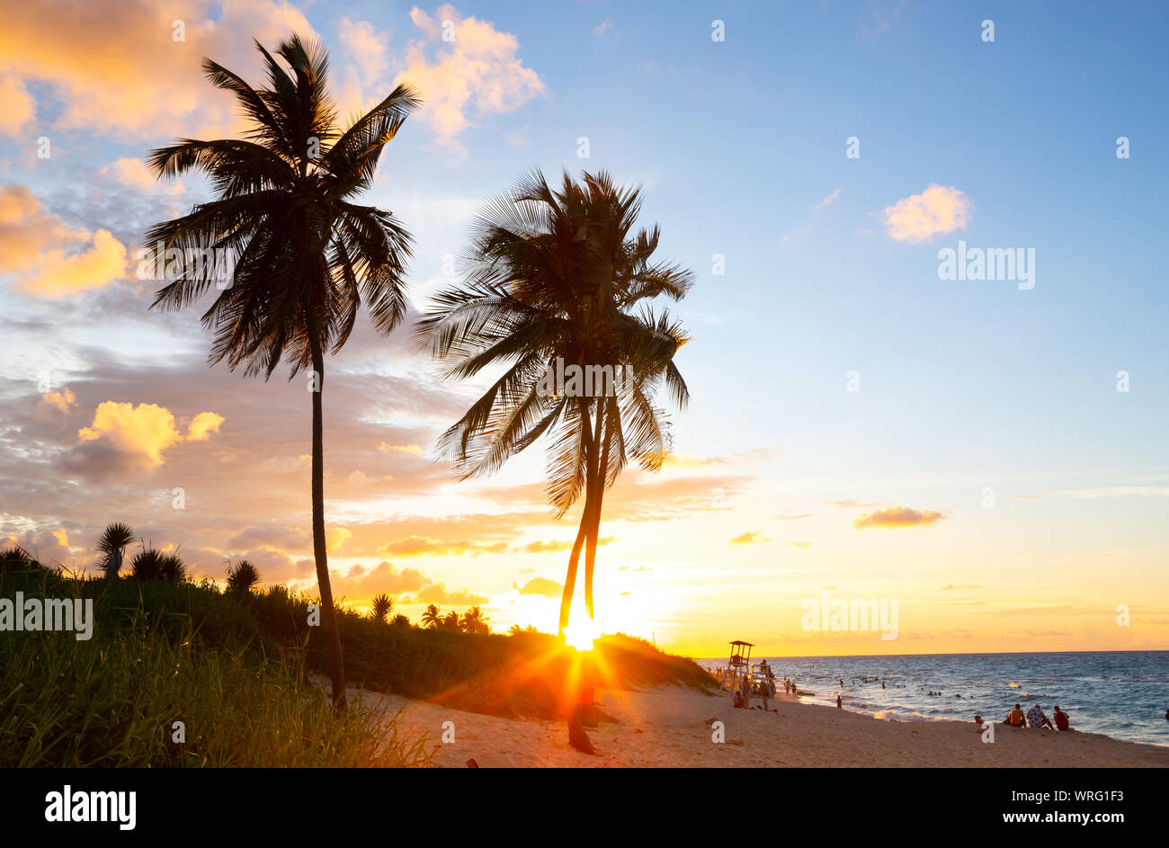Warm glow of the sunset along the Atlantic Ocean at a beach in Cuba Stock Photo