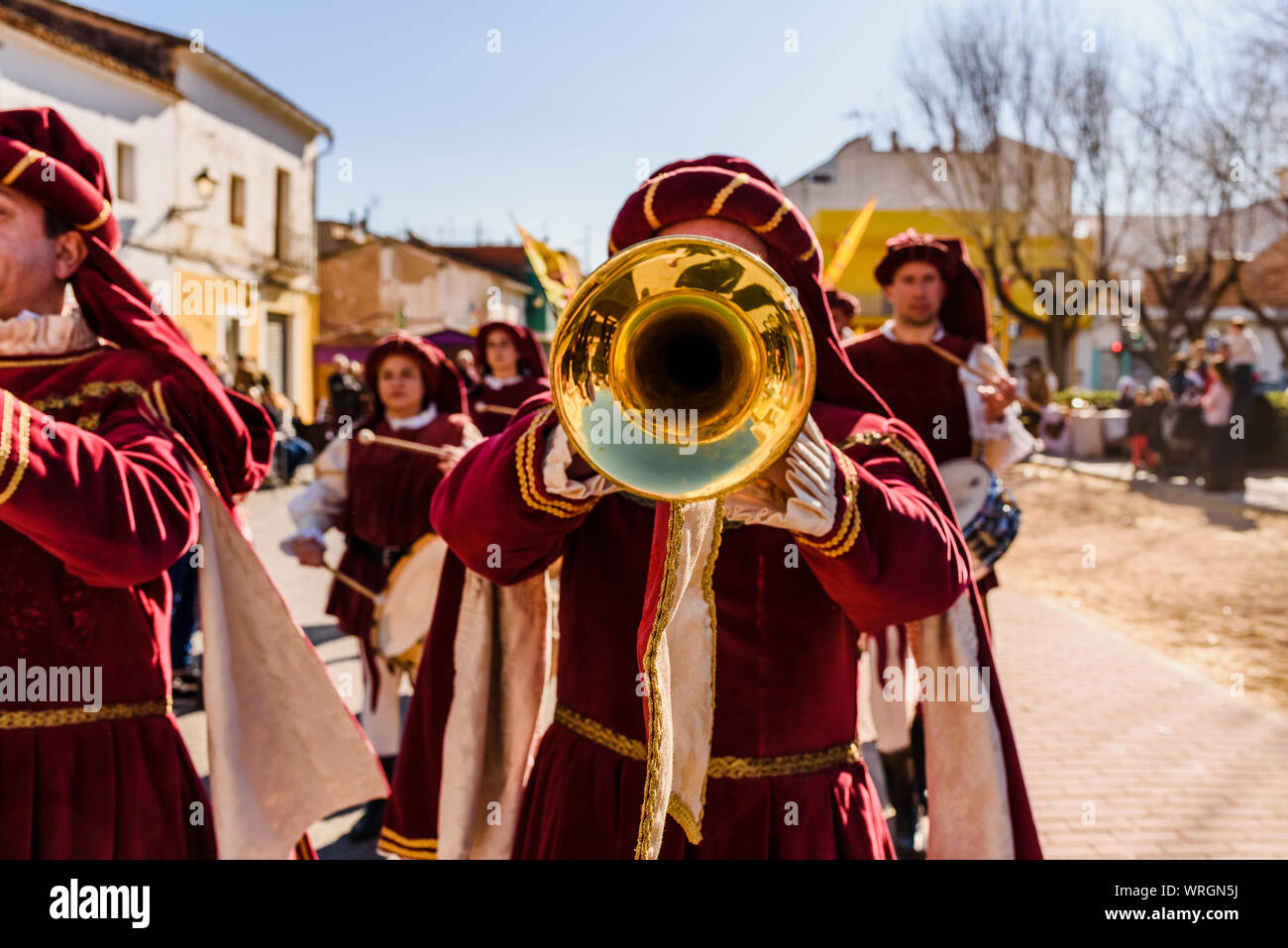 Valencia, Spain- January 27, 2019: Trumpeters dressed as medieval troubadours playing the trumpet during a medieval festival. Stock Photo