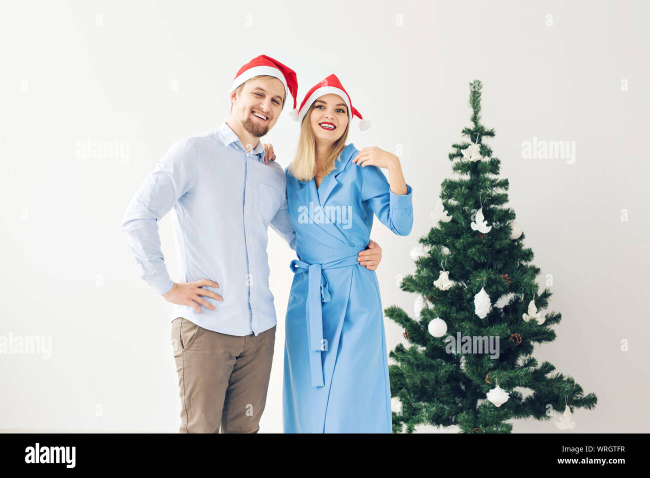 Winter holidays and family concept - Happy young couple near Christmas ...