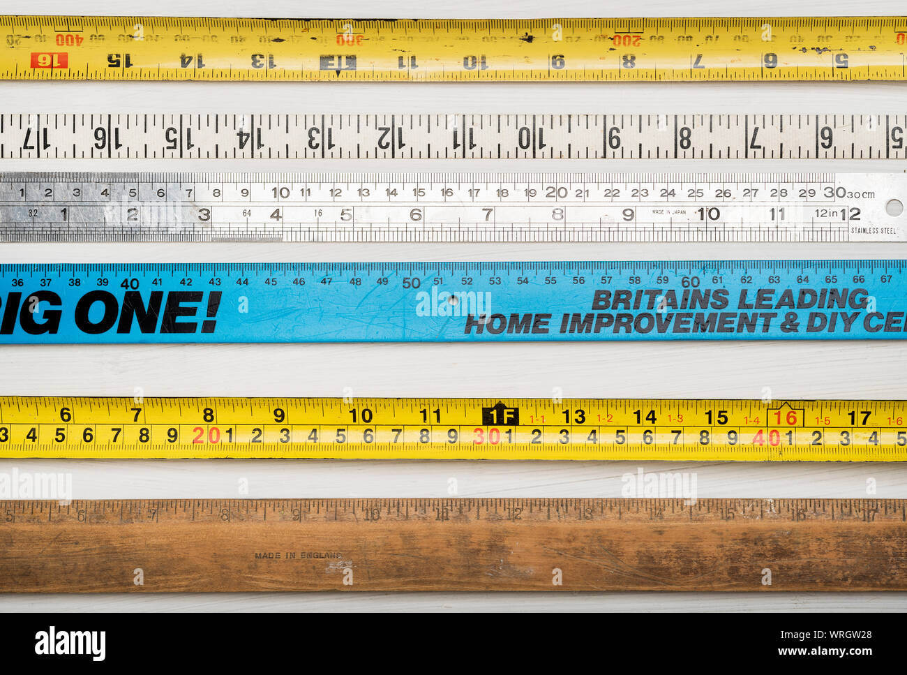 A background arrangement of measurement instruments, rulers and tapes. Stock Photo