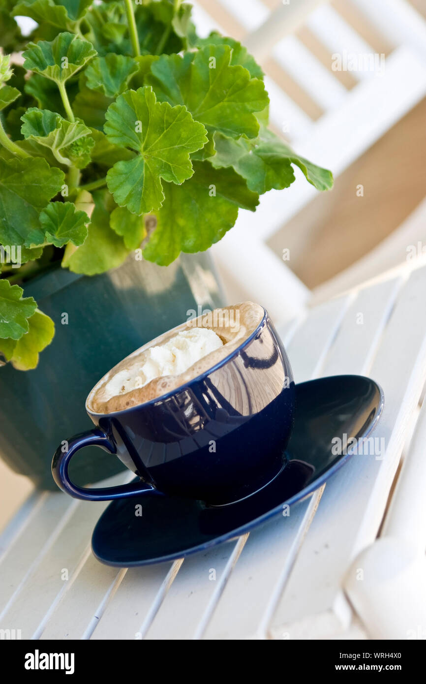cup of coffee outside on table at bistro Stock Photo