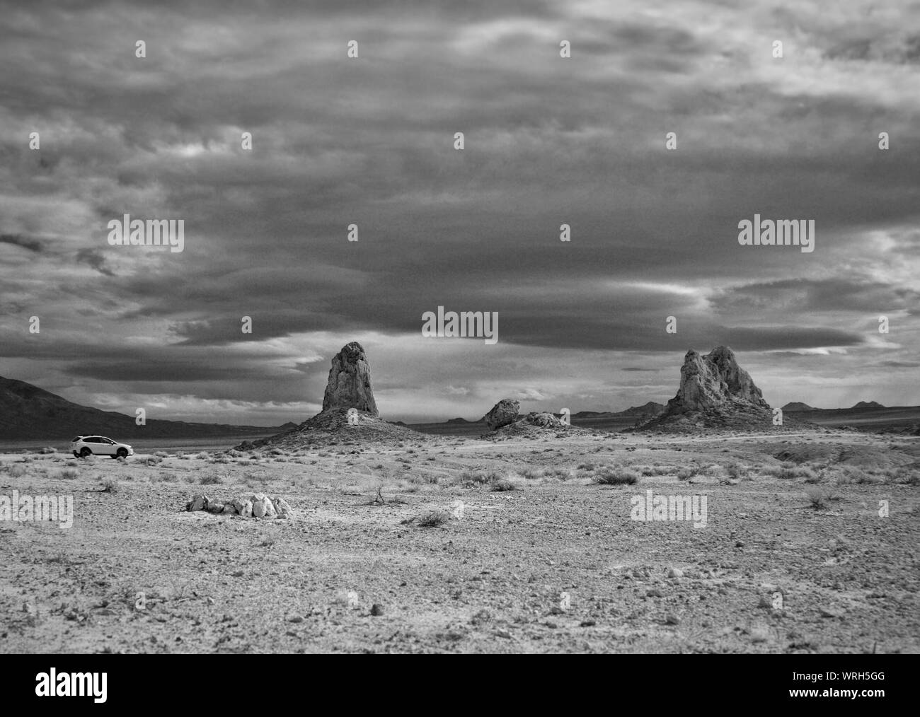 Rock Formation At Trona Pinnacles Against Cloudy Sky Stock Photo