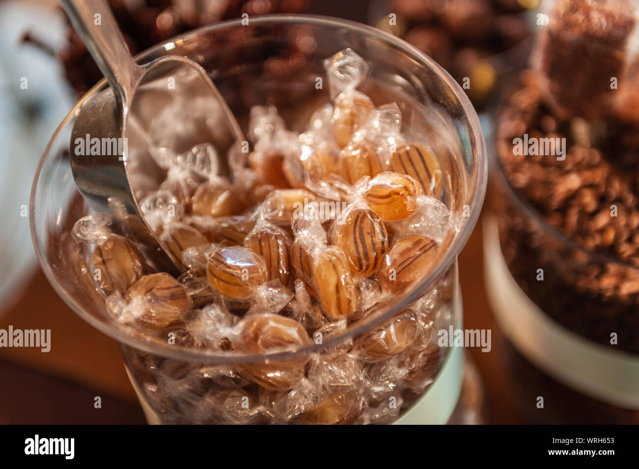 Hard butterscotch candies in a glass jar Stock Photo Alamy