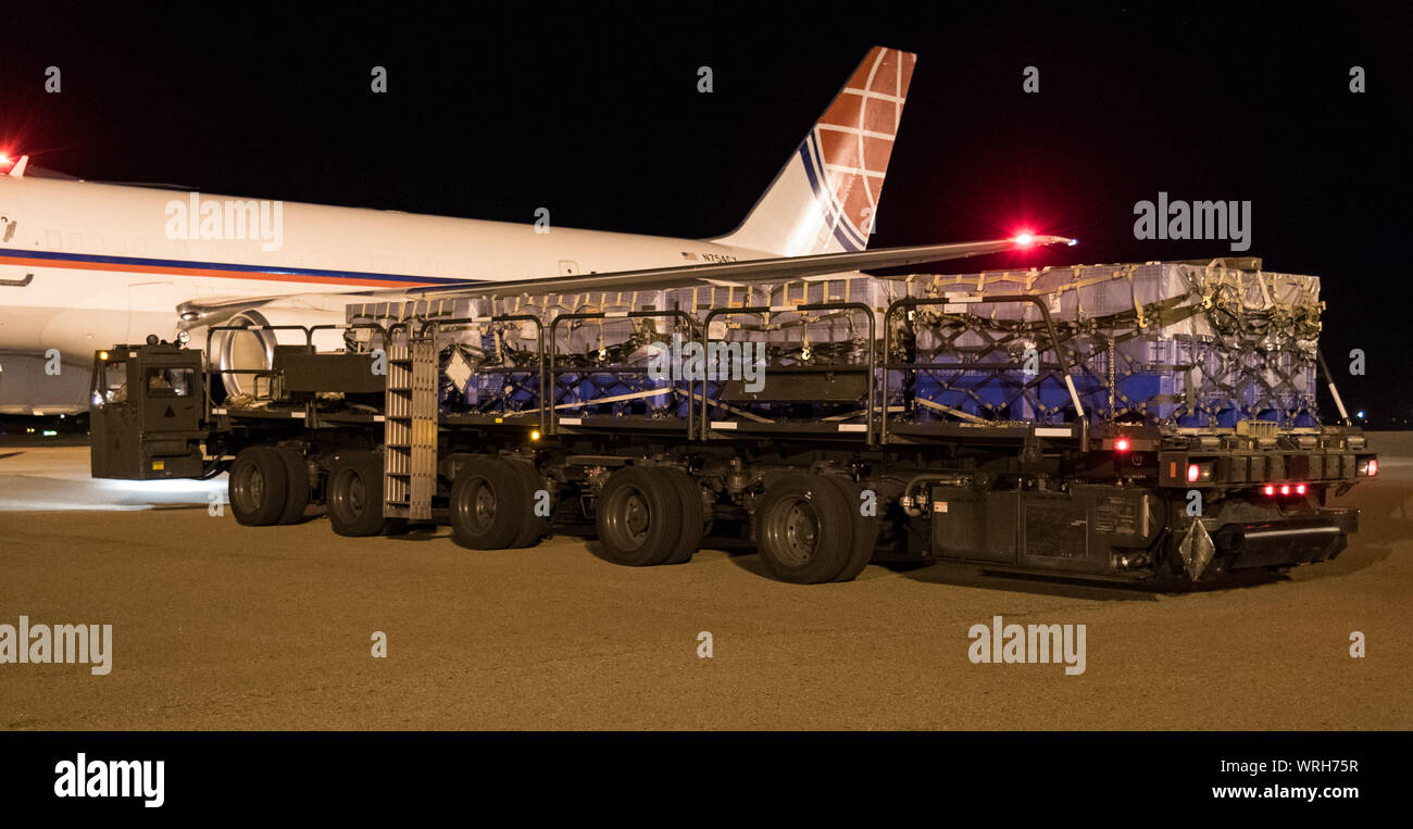 A K-loader with five pallets waits to be marshalled into position by 436th Aerial Port Squadron ramp services personnel Sept. 8, 2019, at Dover Air Force Base, Del. The Air Transport International Boeing 757-200 aircraft, part of the Civil Reserve Air Fleet program, was contracted to transport cargo pallets and 30 Team Dover members to Fairchild AFB, Wash., participating in Mobility Guardian 2019. “In support of exercise Mobility Guardian 2019, Air Mobility Command contracted commercial aircraft to simulate activating CRAF marking the first time, in a long time, AMC has exercised a commercial Stock Photo