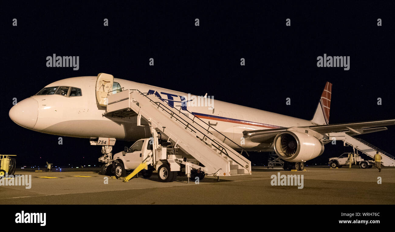 Step trucks sit parked at the forward and aft sections of an Air Transport International Boeing 757-200 Sept. 8, 2019, at Dover Air Force Base, Del. The aircraft, part of the Civil Reserve Air Fleet program, can accommodate up to 10 cargo pallets and has 42 passenger seats. The ATI aircraft was contracted to transport cargo and 30 Team Dover members to Fairchild AFB, Wash., participating in Mobility Guardian 2019. “Air Mobility Command’s commercial airlift partners are a vital part of our daily airlift missions around the world as well as our wartime effort,” said Maj. Adam Crane, AMC Headquar Stock Photo