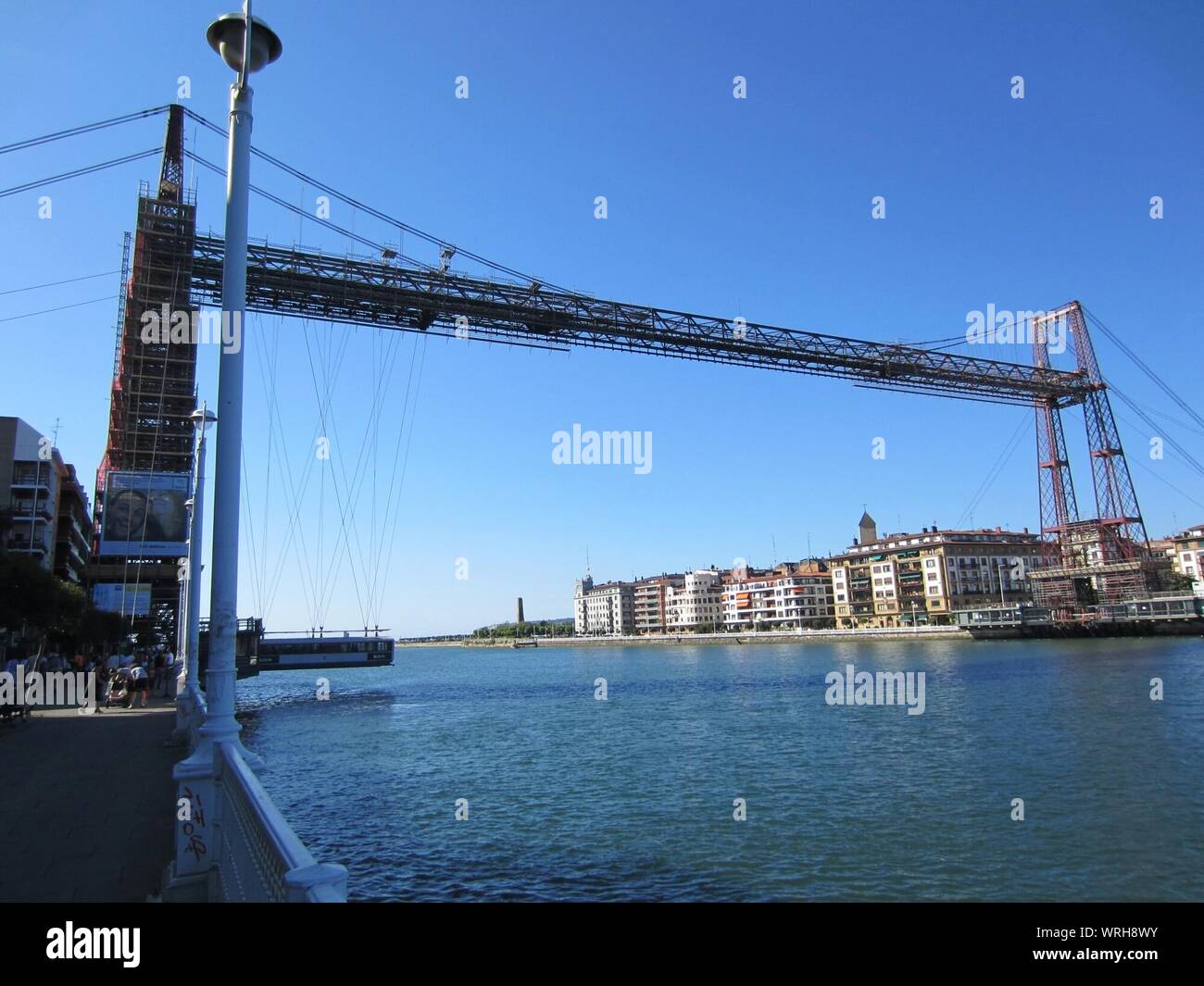 Vizcaya Bridge Against Clear Blue Sky Over Nervion River In City Stock Photo