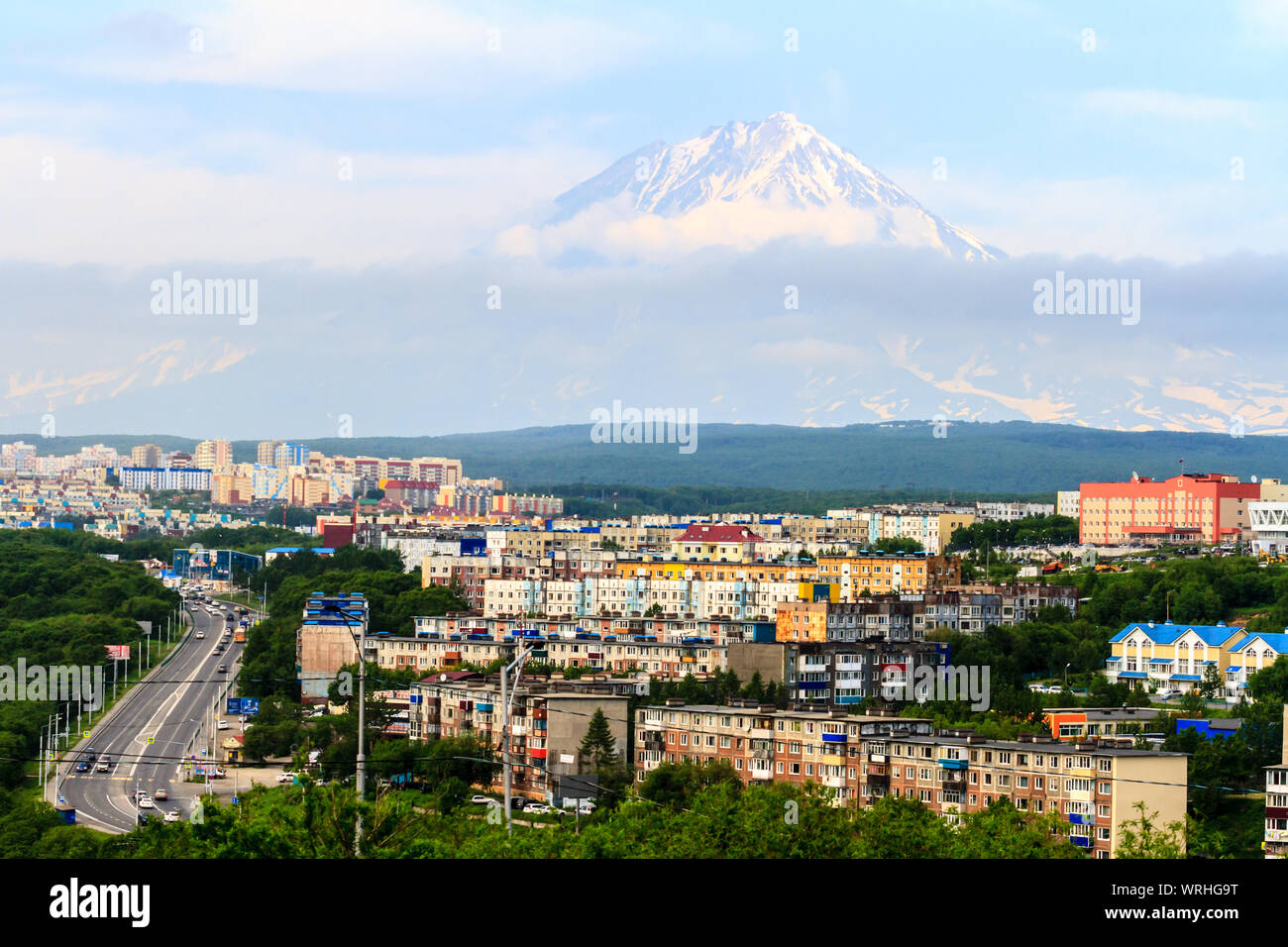 View of the city Petropavlovsk-Kamchatsky on background of Koryaksky Volcano. Russian Far East, Kamchatka Peninsula. Stock Photo
