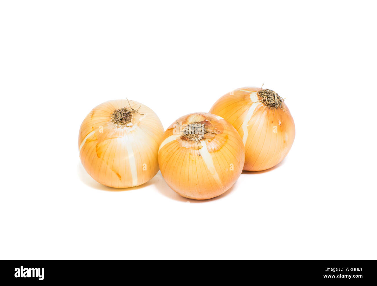 Brown onions isolated on white background Stock Photo - Alamy