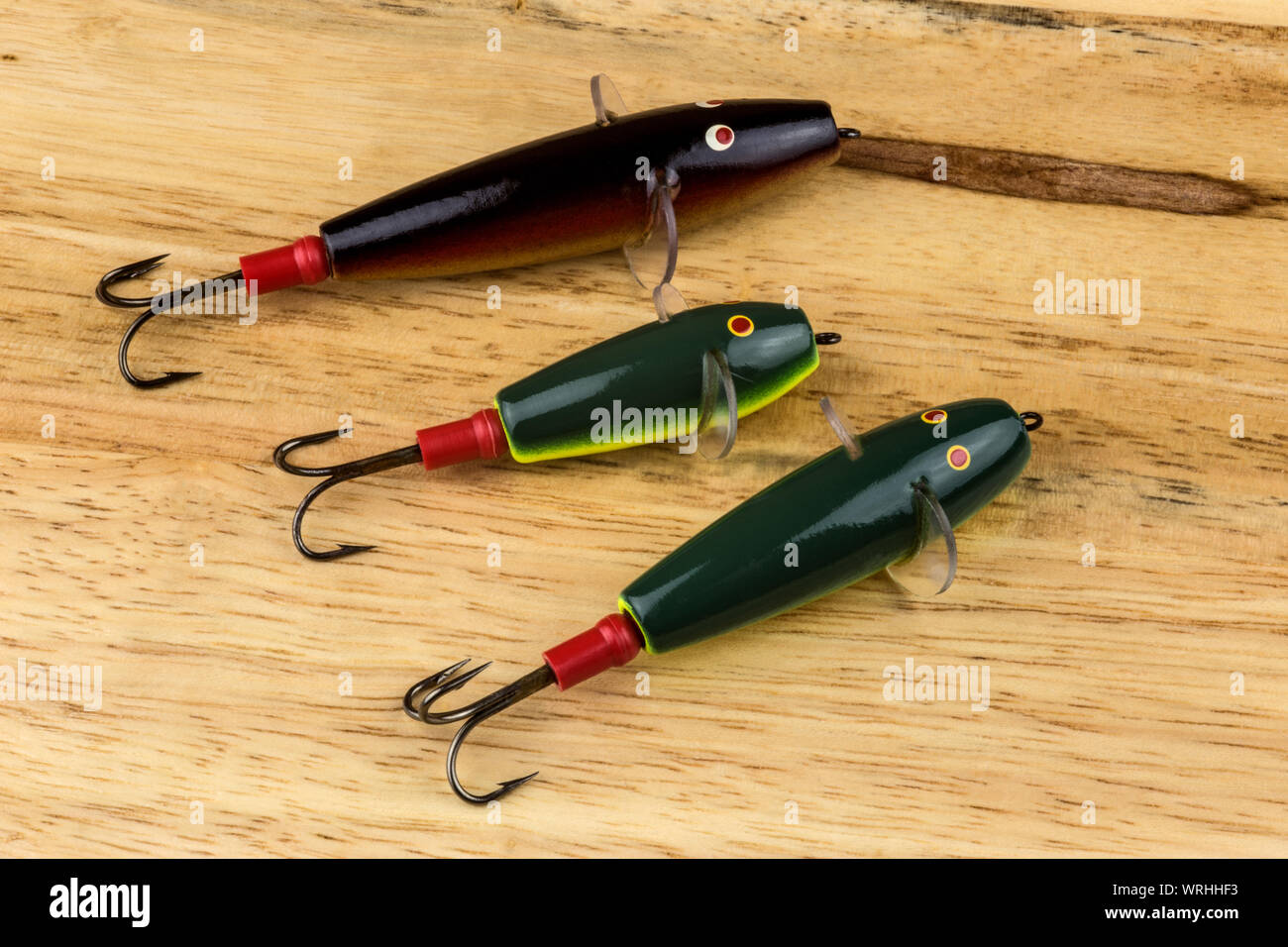 Traditional Devon Minnow salmon fishing lures on a wooden