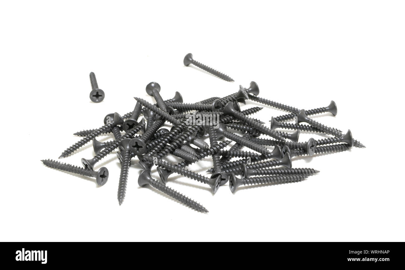 A pile of black screws. Isolated on white. Stock Photo