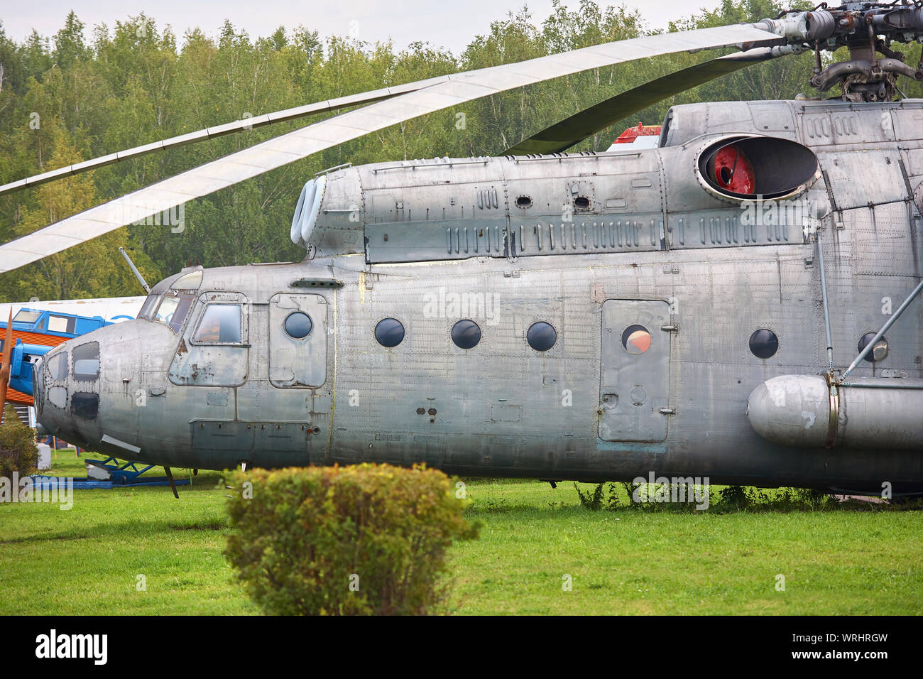 An old military helicopter painted gray closeup. Stock Photo