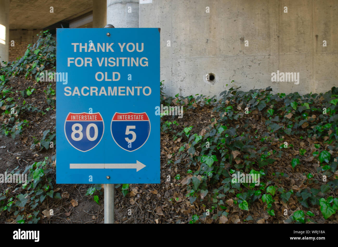 Blue thank you for visiting old Sacramento Sign featuring interstate 5 and Interstate 80 Stock Photo