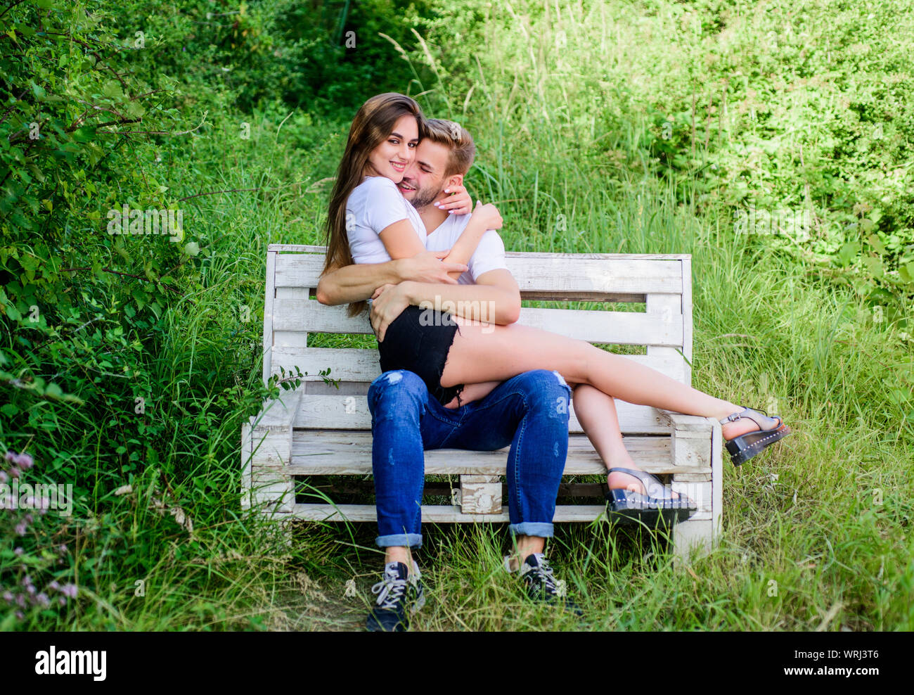 Happy To Be Together Couple In Love Happiness Man With Woman In Park Happy Valentines Day Summer Camping In Forest Family Weekend Romantic Date Couple Relax Outdoor On Bench Secret Place Stock
