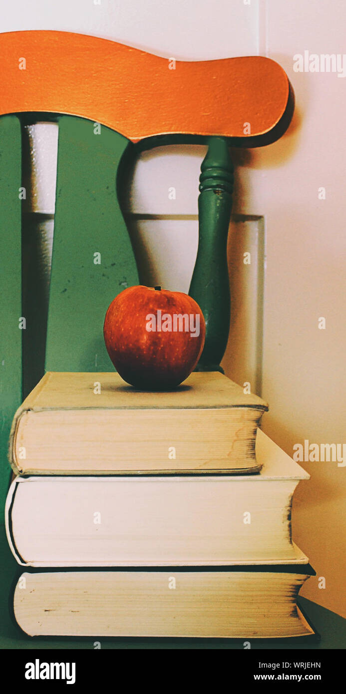 Apple On Top Of Books Stock Photo