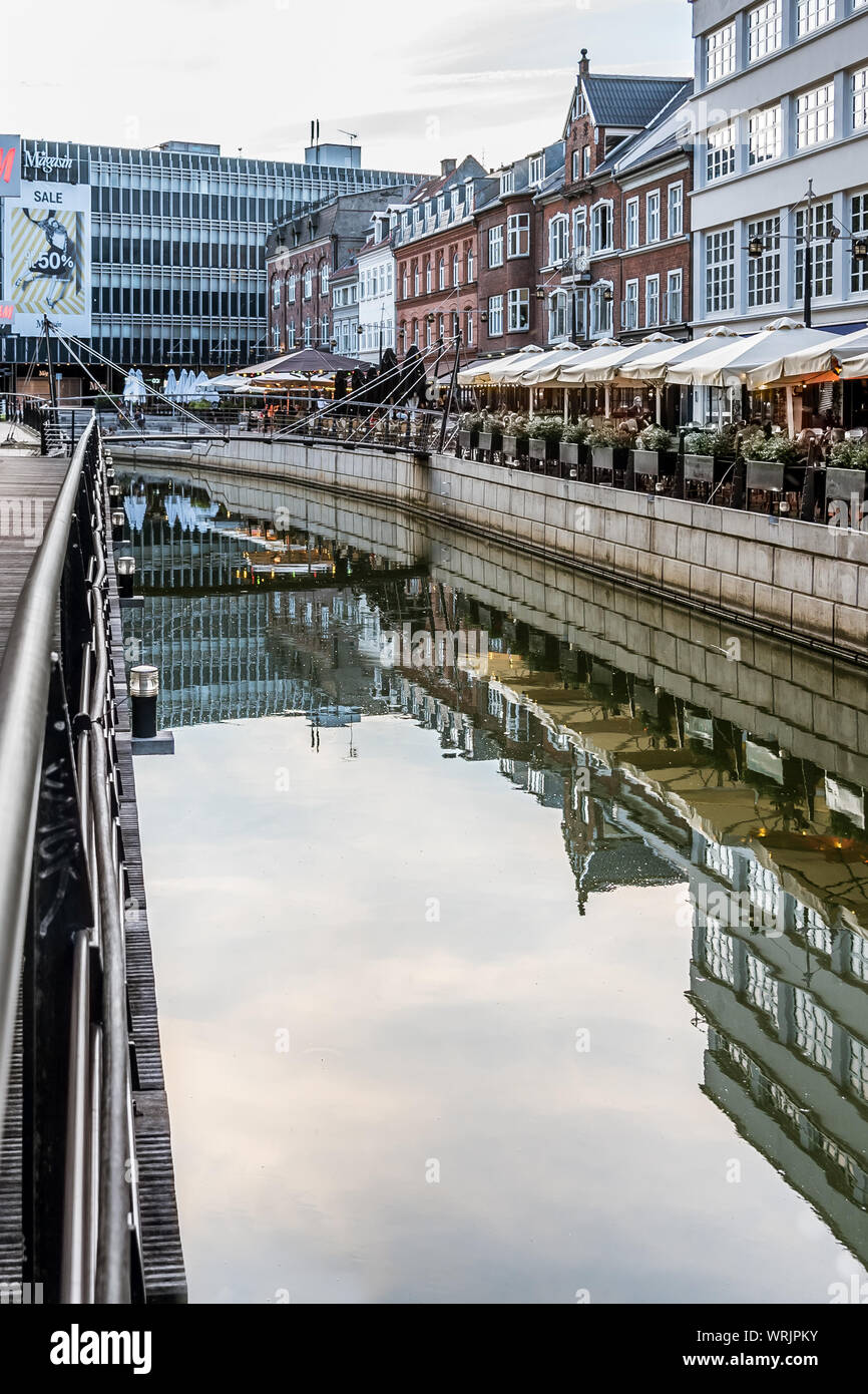 Aarhus Downtown with restaurants reflecting in the canal and space for copy, Denmark, July 15, 2019 Stock Photo