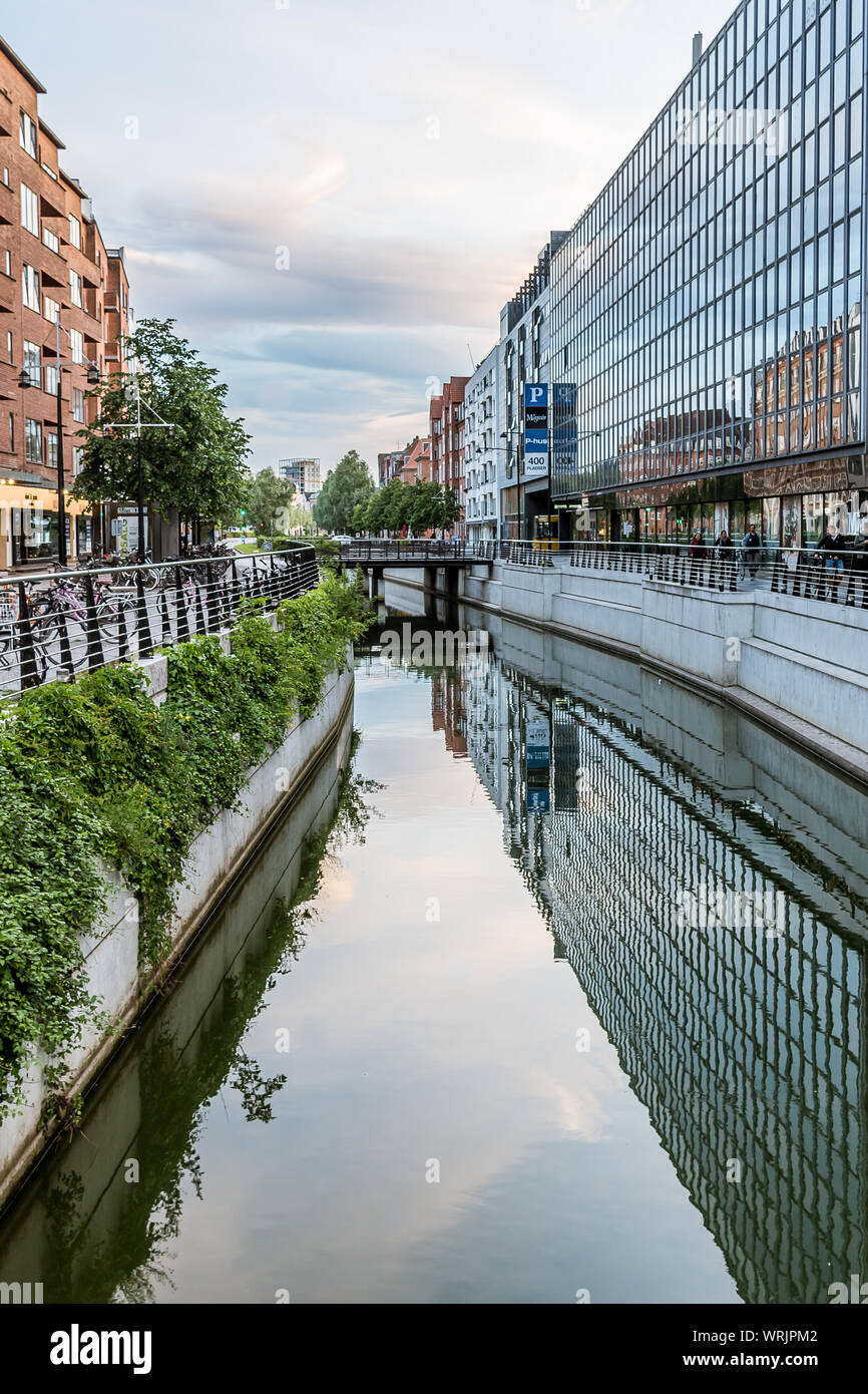 Aarhus city with space for text and an office building in glass, reflecting in the canal, Denmark, July 15, 2019 Stock Photo