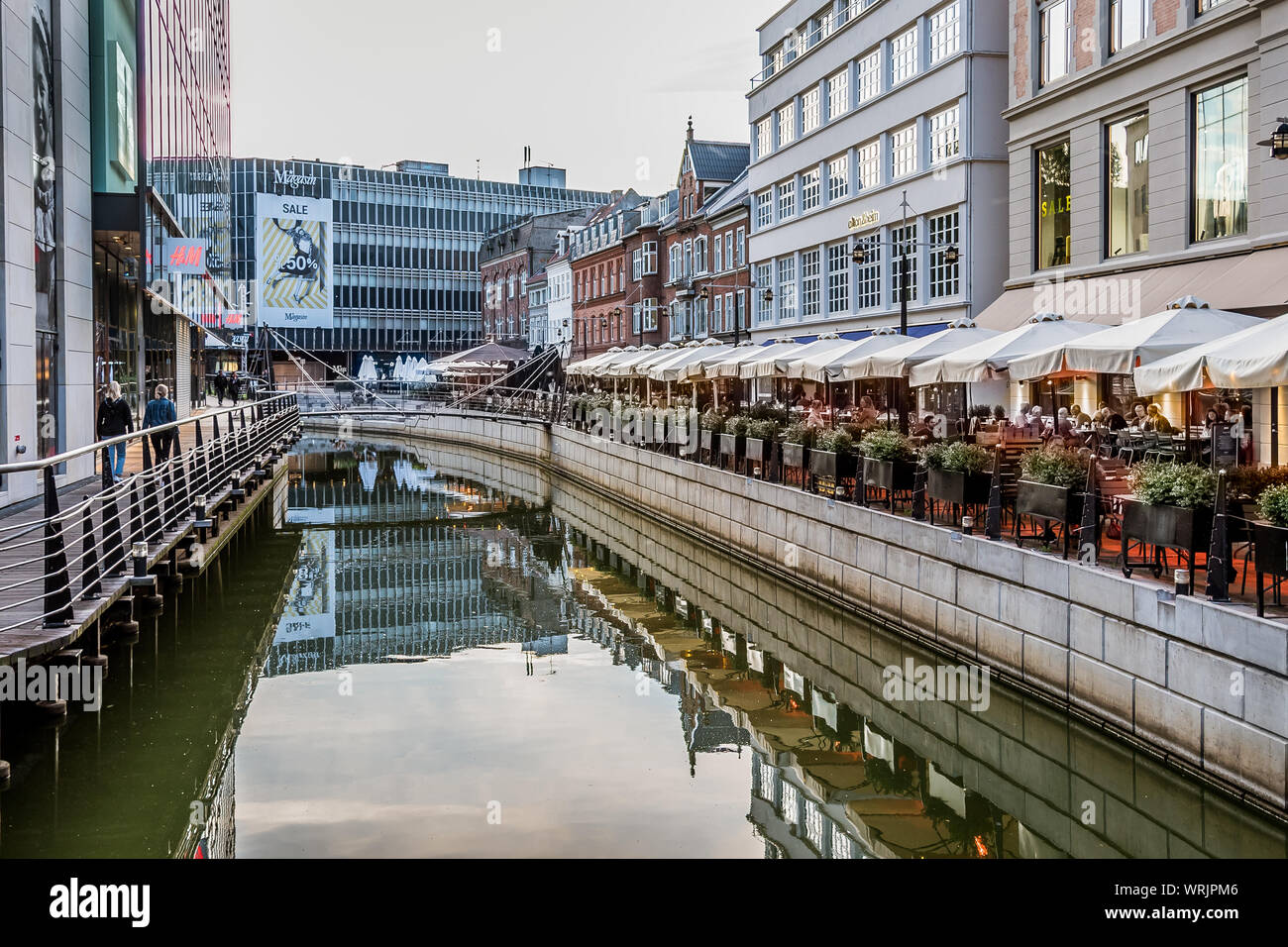 Downtown Aarhus with restaurants reflecting in the canal in the evening, Denmark, July 15, 2019 Stock Photo