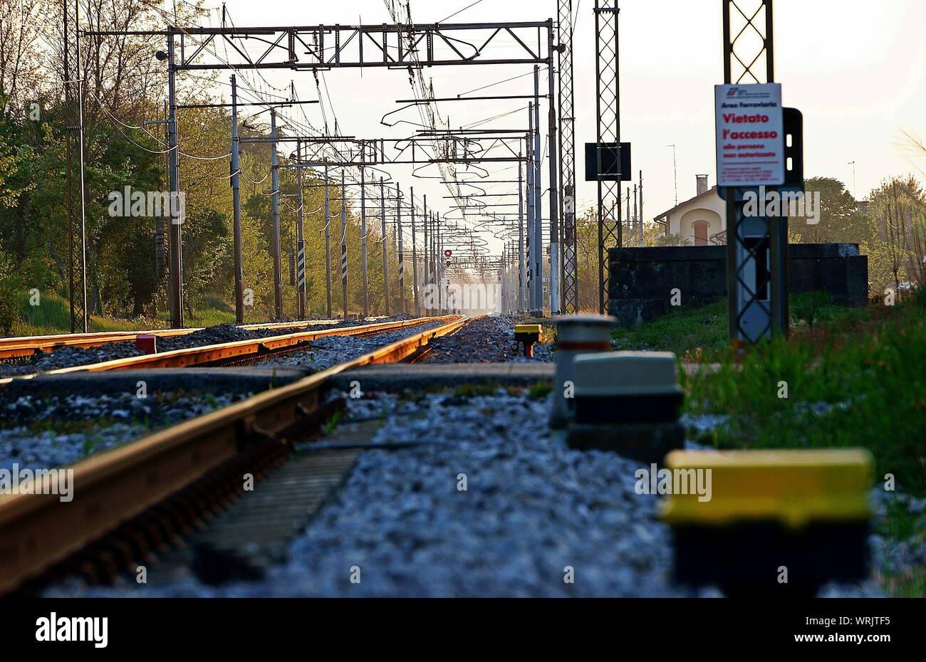Railroad Tracks And Metal Poles Stock Photo Alamy