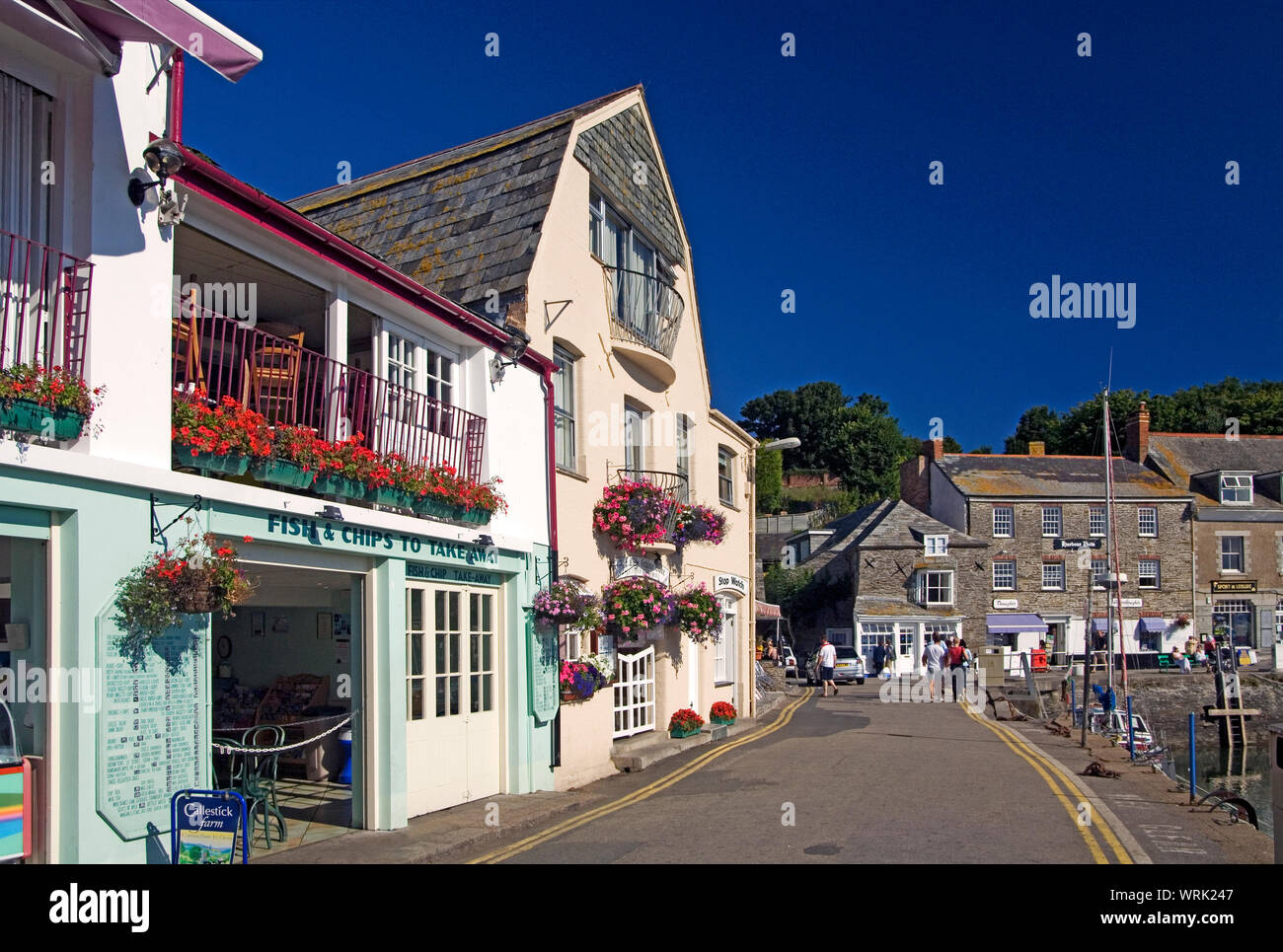 The buildings around the harbour at Padstow are evocative of centuries of tradition even if used as tourist shops Stock Photo
