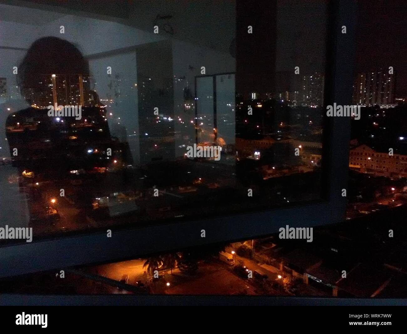 View Of City Through Window At Night Stock Photo Alamy