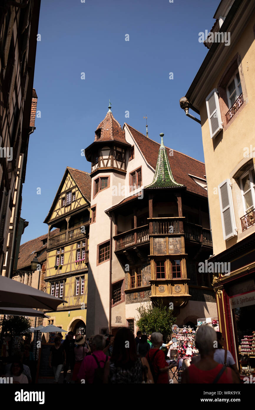 Rue des Marchands in Colmar, France, dominated by the Renaissance building Maison Pfizer and Zum Kragen. Stock Photo