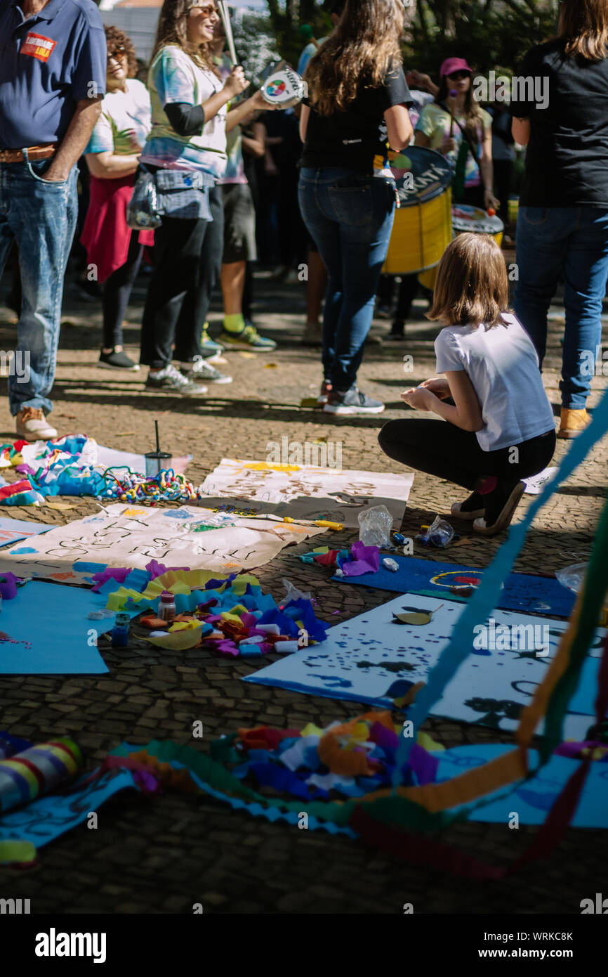Children making banners for a march, in a pro environment protest during the brazilian independence day Stock Photo