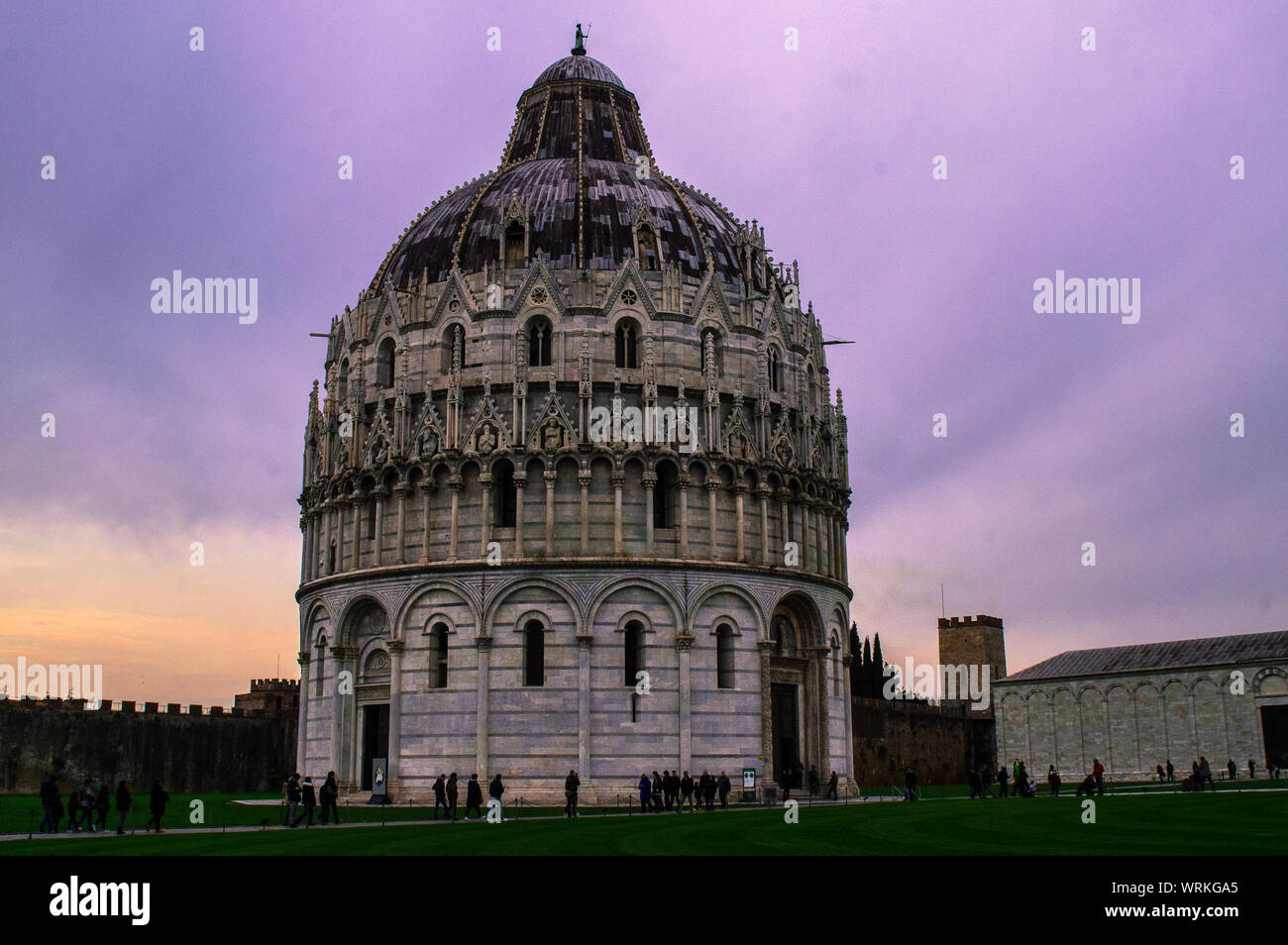 Low Angle View Of Piazza Dei Miracoli Against Cloudy Sky During Dusk Stock Photo