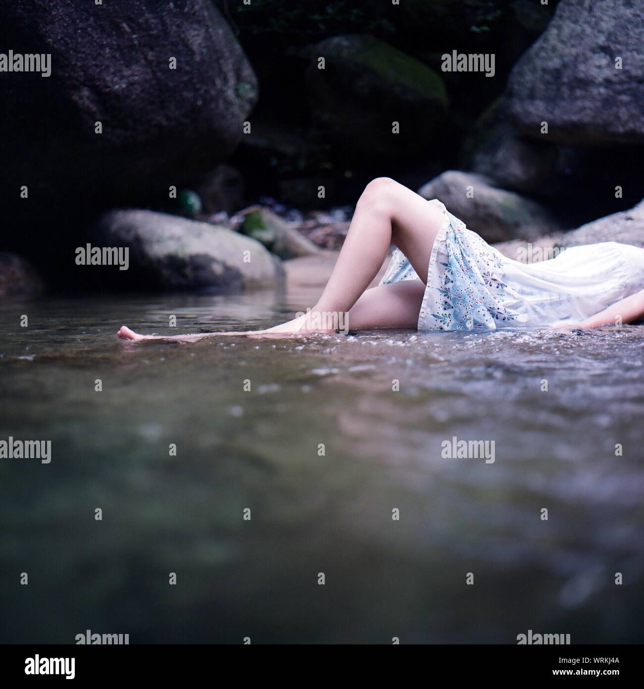 Person lying down in water hi-res stock photography and images - Alamy