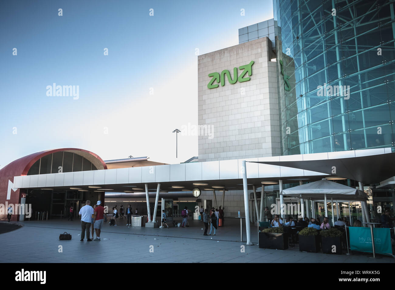 Lisbon, Portugal - August 7, 2018: exterior view of Lisbon International Airport where travelers walk on a summer day Stock Photo