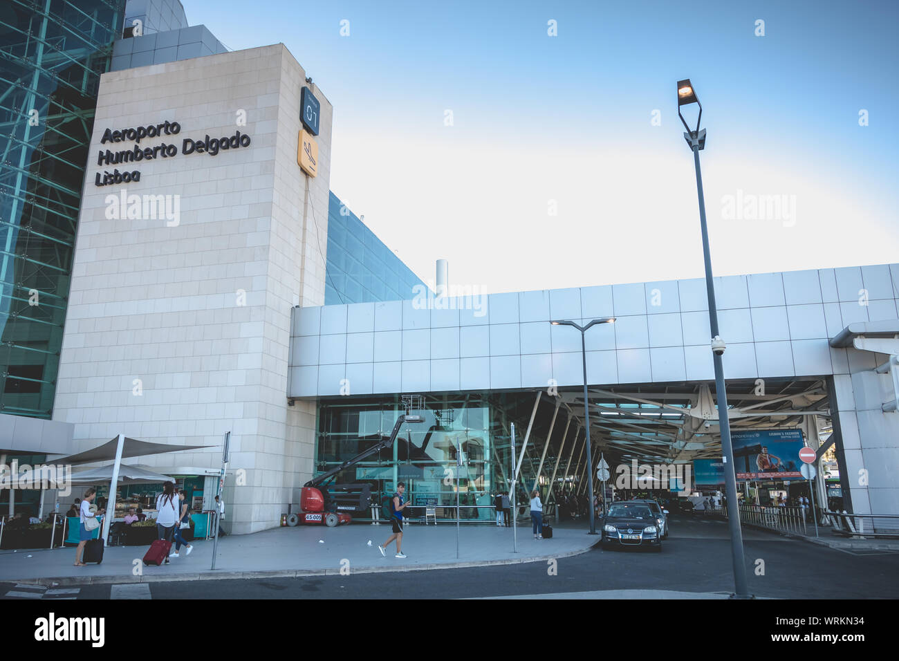 Lisbon, Portugal - August 7, 2018: exterior view of Lisbon International Airport where travelers walk on a summer day Stock Photo