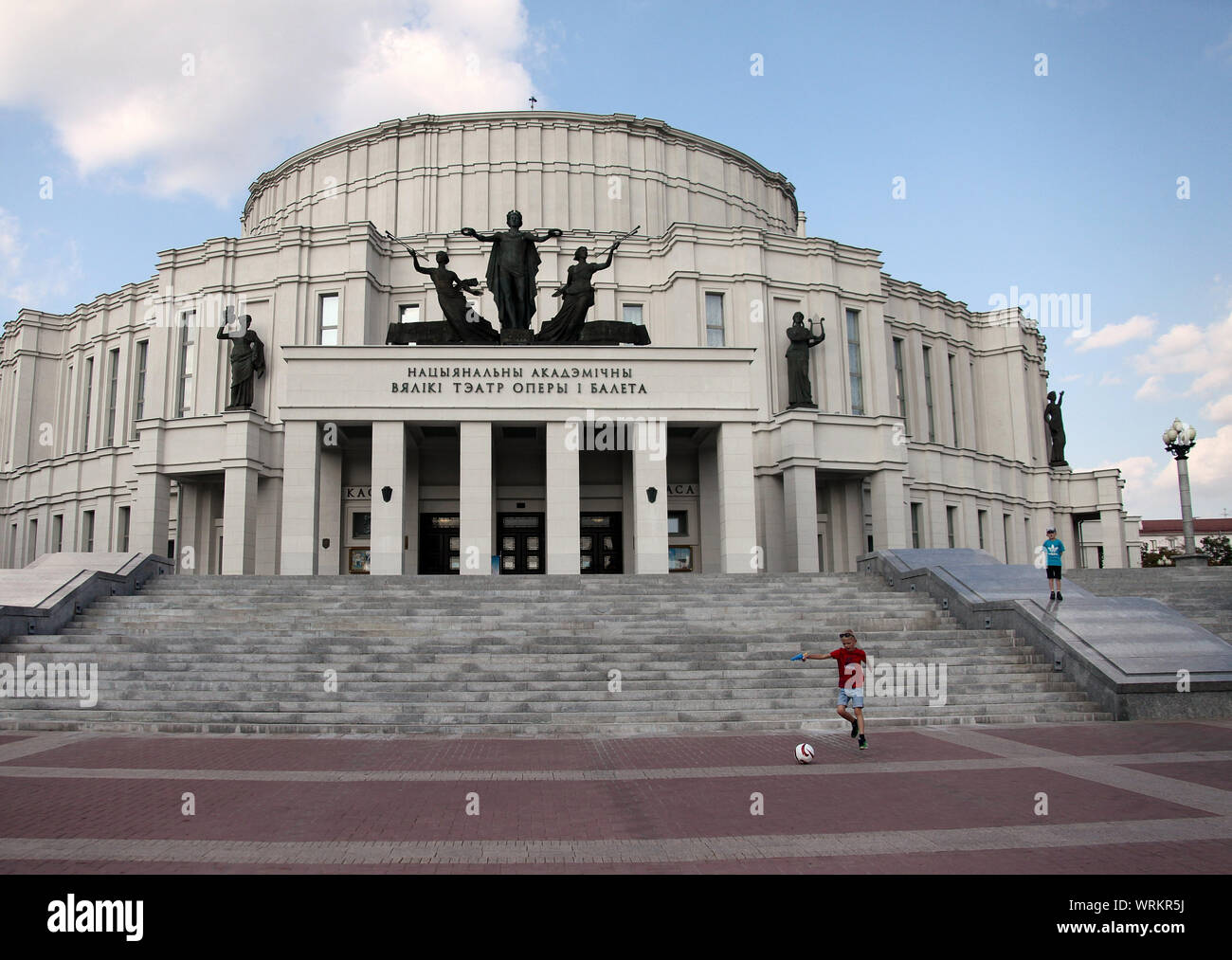 Boys playing outside the National Academic Bolshoi Opera and Ballet Theatre in Minsk Stock Photo