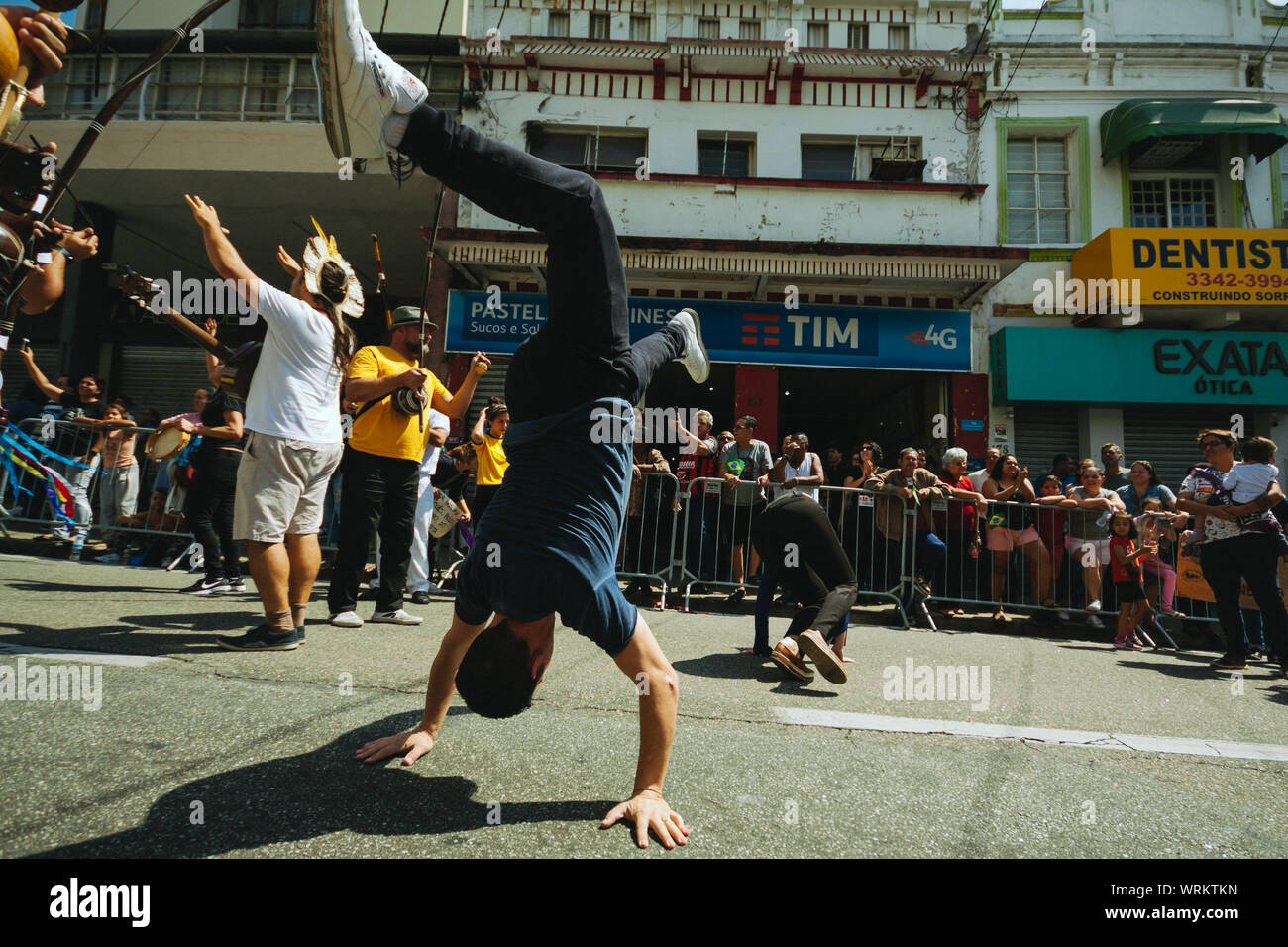 Capoeira fighters between a crowd in the streets during a pro environment protest during the brazilian independence day, asking to save the amazonia. Stock Photo