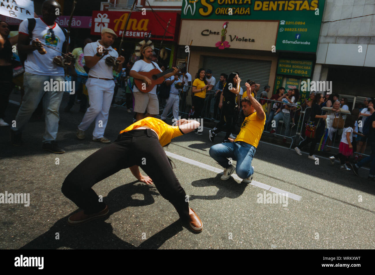 Capoeira fighters between a crowd in the streets during a pro environment protest during the brazilian independence day, asking to save the amazonia. Stock Photo