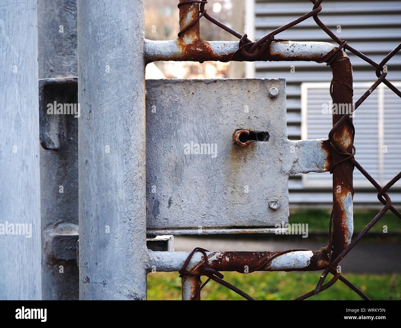 Close-up Of Locked Rusty Metal Gate Stock Photo