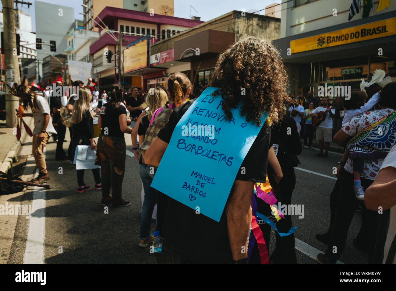 Crowd in the streets with man using a manifestation banner, in a pro environment walk, protest during the brazilian independence day Stock Photo