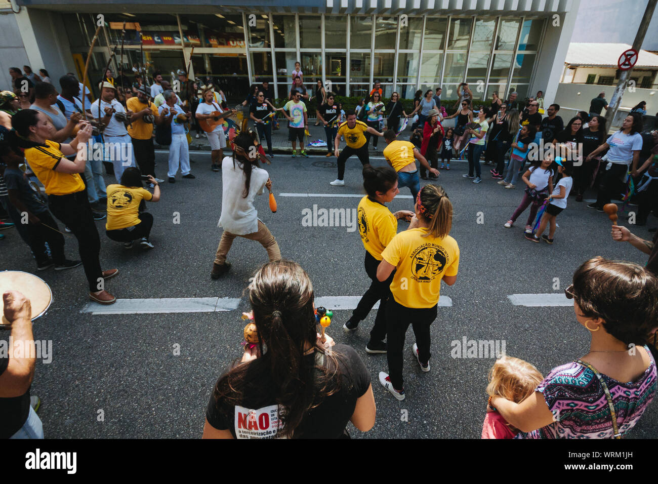 Capoeira fighters between a crowd in the streets during a pro environment protest during the brazilian independence day, asking to save the amazonia. Stock Photo