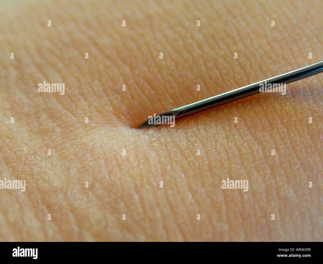 Close-up Of Person Getting Injected Stock Photo