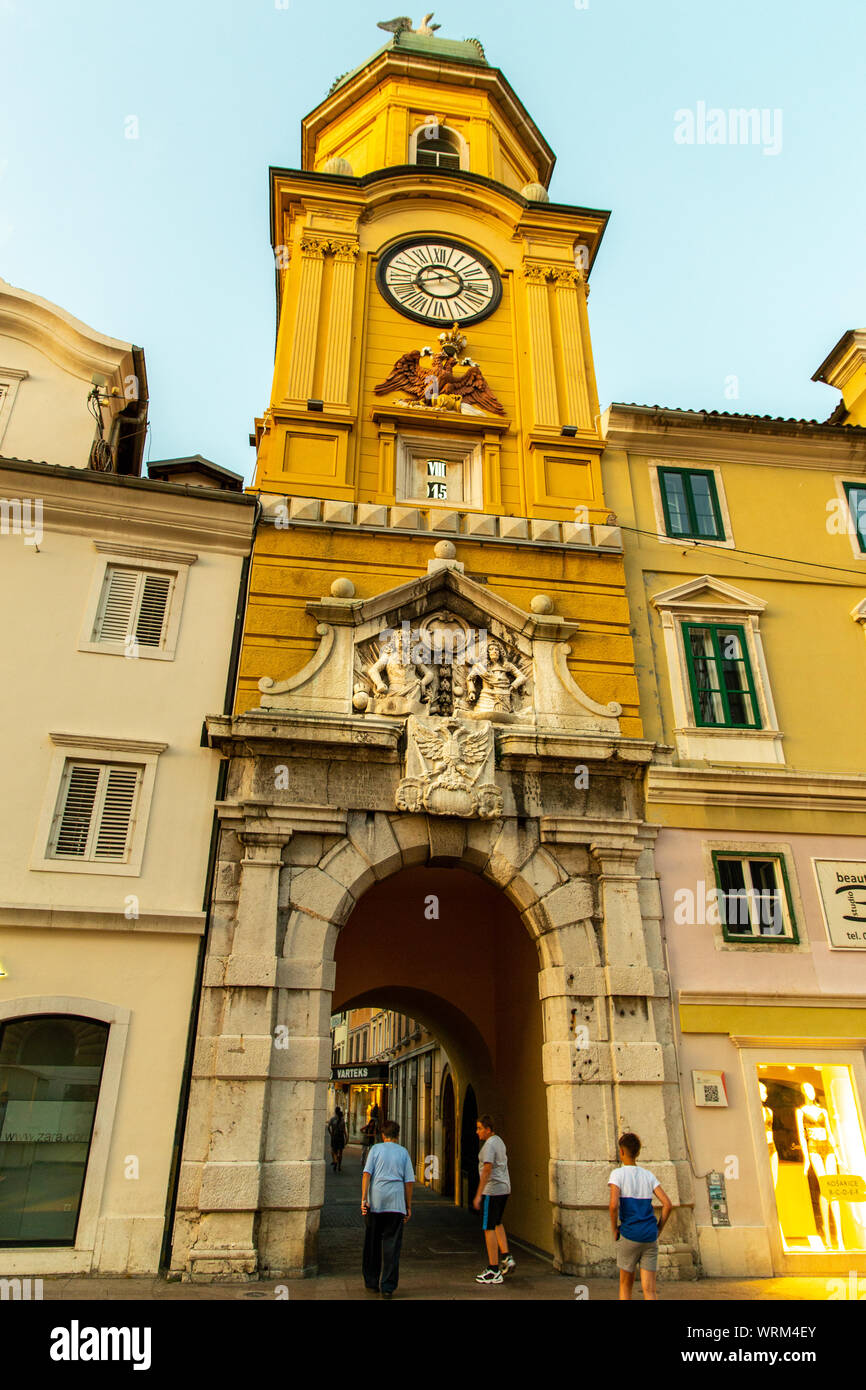 Baroque City clock Tower amd archway forming one of the entrances to the old fortified city.  It was designed by Filbert Bazarig in1876. Korzo, Rijeka Stock Photo